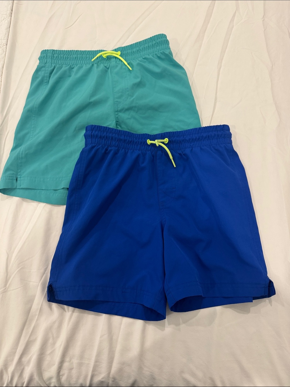 Set of 2, Boys Swim Shorts.Teal and Royal Blue. Both used and size Large (10-12)